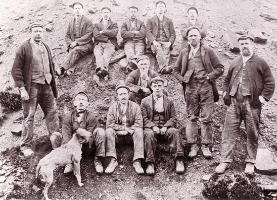Typical quarryman's dress, nicknamed 'Brownbacks'.  Members of the Caygill Family, thought to be in Cragg or Ding quarry.