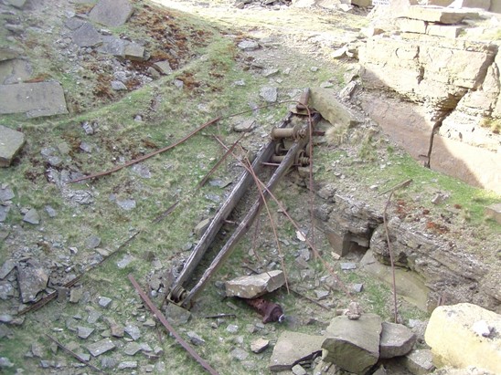 Collapsed crane in open pit